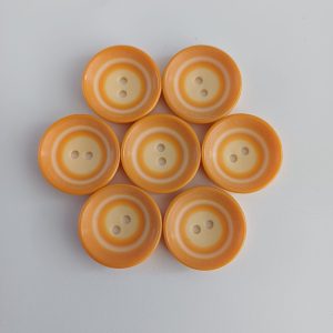 Oranje knopen 7 stuks